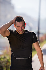 Image showing man pouring water from bottle on his head