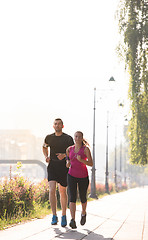 Image showing young couple jogging  in the city