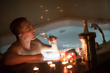 Image showing man relaxing in the jacuzzi