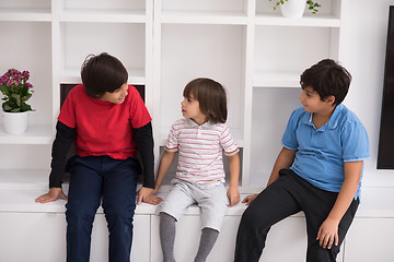 Image showing young boys posing on a shelf