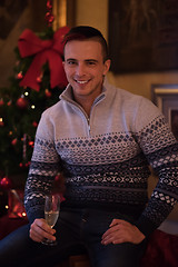 Image showing Happy young man with a glass of champagne