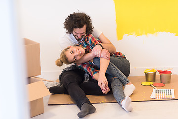 Image showing Happy young couple relaxing after painting