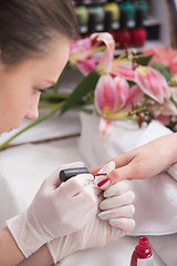 Image showing Woman hands receiving a manicure