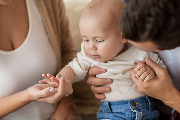 Image showing close up of happy family with baby at home