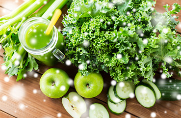 Image showing close up of jug with green juice and vegetables