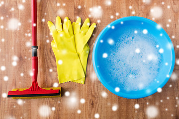 Image showing basin with soap water, rubber gloves and squeegee