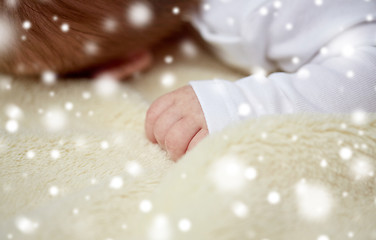 Image showing close up of baby lying on soft furry blanket