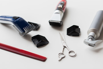 Image showing styling hair sprays, clippers, comb and scissors