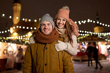 Image showing happy couple hugging at christmas market