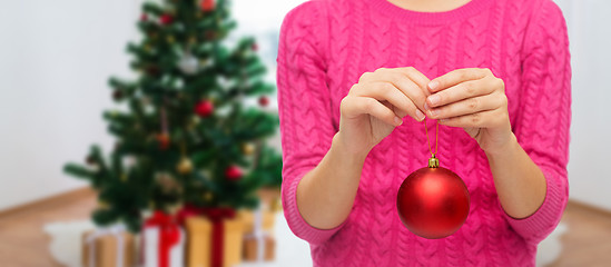 Image showing close up of woman hands with christmas ball