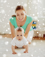 Image showing happy mother playing with baby at home