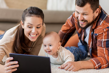 Image showing mother, father and baby with tablet pc at home