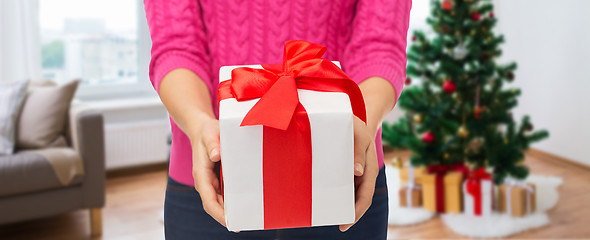 Image showing close up of woman hands holding christmas gift