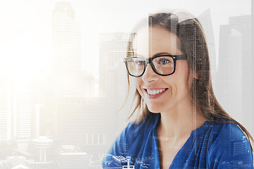 Image showing close up of smiling middle aged woman in glasses