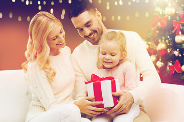 Image showing happy family with christmas gift