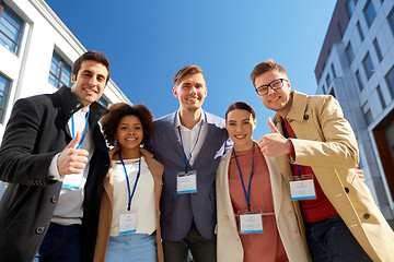 Image showing business team with conference badges in city