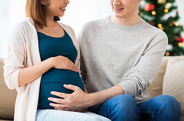 Image showing close up of man and pregnant woman at christmas