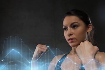 Image showing woman holding fists and fighting in gym