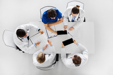 Image showing doctors with cardiograms and tablet pc at hospital