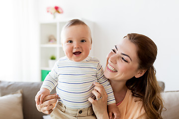 Image showing happy young mother with little baby at home