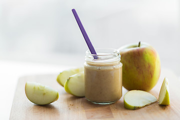 Image showing jar with apple fruit puree or baby food on table