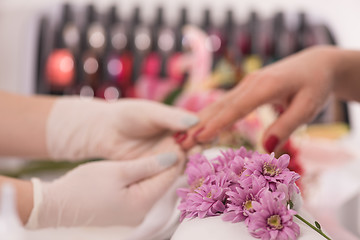 Image showing Woman hands receiving a manicure