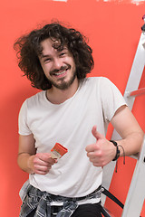 Image showing man with funny hair over color background with brush