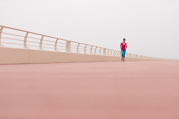 Image showing woman busy running on the promenade