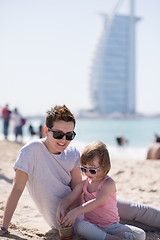 Image showing Mom and daughter on the beach