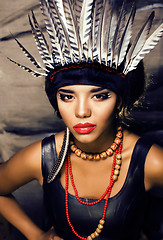 Image showing young pretty woman with make up like red indian, futher in hair,