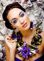 Image showing floral face art with anemone in jewelry, sensual young brunette 