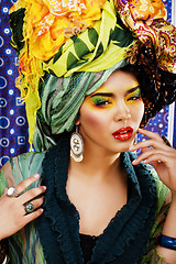 Image showing beauty bright woman with creative make up, many shawls on head l