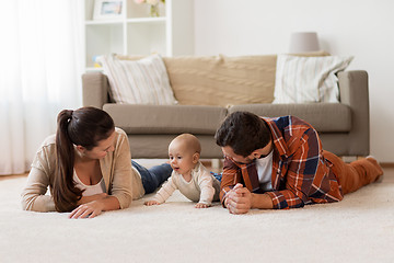 Image showing happy family playing with baby at home