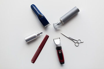 Image showing styling hair sprays, clippers, comb and scissors