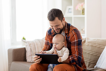 Image showing happy father and baby boy with tablet pc at home