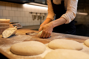Image showing chef or baker cooking dough at bakery
