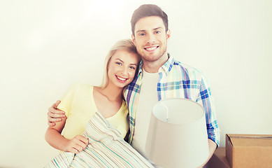 Image showing happy couple with stuff moving to new home