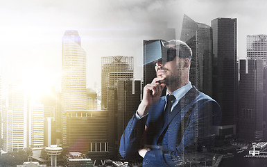 Image showing businessman in virtual reality headset over city