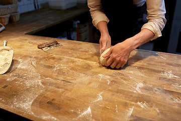 Image showing baker making bread dough at bakery kitchen