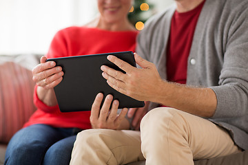 Image showing senior couple with tablet pc at christmas