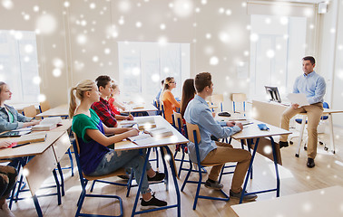 Image showing group of students and teacher with papers or tests