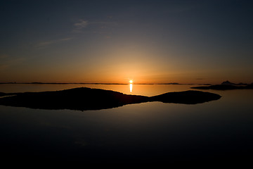 Image showing Sunset over some small islands