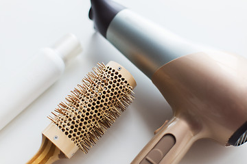 Image showing hairdryer, brush and hot styling hair spray