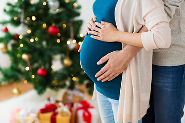 Image showing man and pregnant woman home at christmas