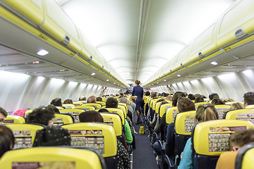 Image showing Interior of commercial airplane during flight.