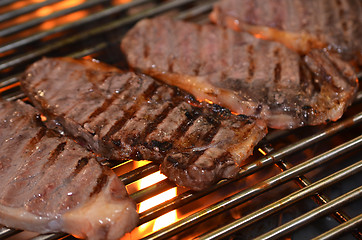 Image showing Beef steaks on the grill