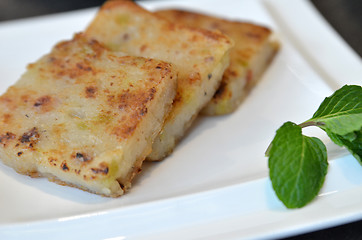 Image showing Fried carrot cake on white plate 