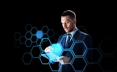 Image showing businessman with tablet pc and network hologram