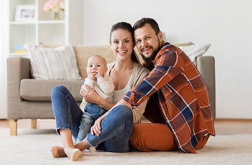 Image showing happy family with baby having fun at home