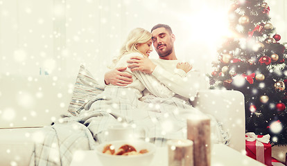 Image showing happy couple at home with christmas tree